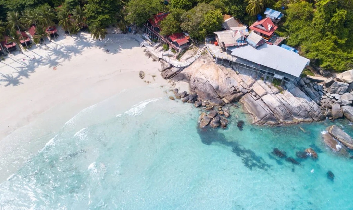 The Soft Pale Sand and the Pale Turquoise Waters of Silver Beach