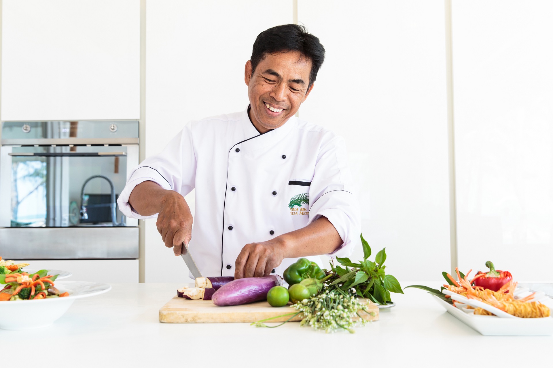 An in-villa chef preparing a dish at Villa Mia Beach