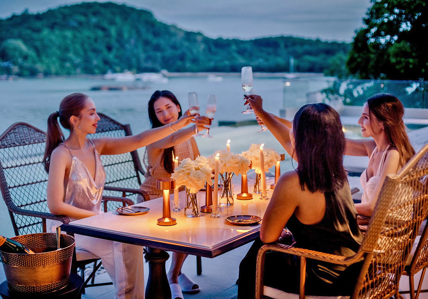 A group of friends having a lovely evening dinner at the villa